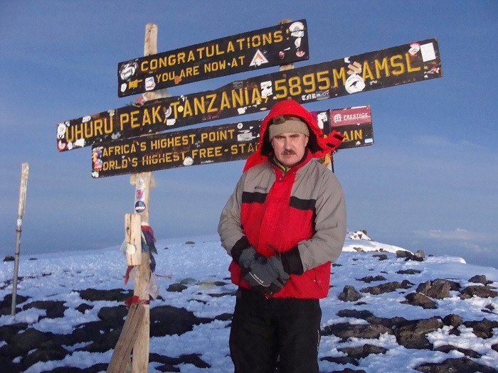 Igor Kalyaev on top of Mount Kilimanjaro — the tallest stratovolcano in Africa. 