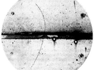 Pictured is the first-ever observation of positron in the Wilson chamber in the magnetic field. Image source: Carl D. Anderson (1905–1991) — Anderson, Carl D. (1933). “The Positive Electron.” Physical Review 43 (6): 491-494. Wikipedia, public domain.